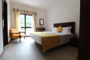 Postel nebo postele na pokoji v ubytování Gerês Guest House