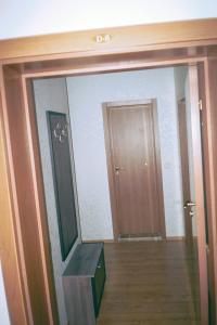 a room with a doorway with a mirror and a door at Apartment Rutland Beach in Ravda