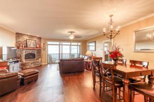 a living room with a table and a dining room at Reserve 36-D in Sugar Mountain