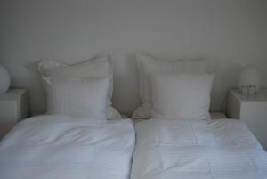 Ένα ή περισσότερα κρεβάτια σε δωμάτιο στο Rum og rooms