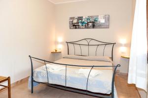 Postel nebo postele na pokoji v ubytování Lu Lioni Rooms