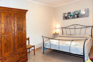 Postel nebo postele na pokoji v ubytování Lu Lioni Rooms