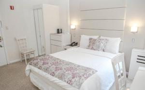 Postel nebo postele na pokoji v ubytování Da Vinci Hotel