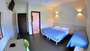 Postel nebo postele na pokoji v ubytování Albergo Riviera Spineta
