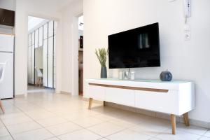 A television and/or entertainment centre at Anemi Deluxe Apartment