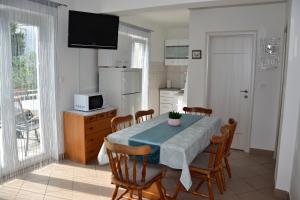 Kuchyň nebo kuchyňský kout v ubytování Apartmani Novosel