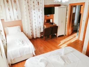 Postel nebo postele na pokoji v ubytování Istanbul Sydney Hotel