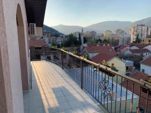 a balcony of a building with a view of a city at Apartman Grande Ajna in Mostar