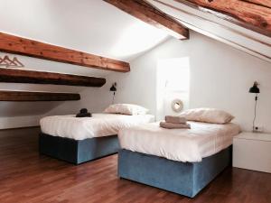 Ένα ή περισσότερα κρεβάτια σε δωμάτιο στο Casa Bibiana