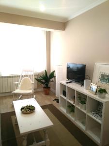 Televízia a/alebo spoločenská miestnosť v ubytovaní Torre Center II