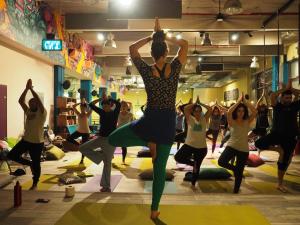 a group of people doing yoga in a room at Abraham Tel Aviv in Tel Aviv
