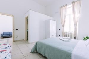 Postel nebo postele na pokoji v ubytování Pangea e Panthálassa B&B