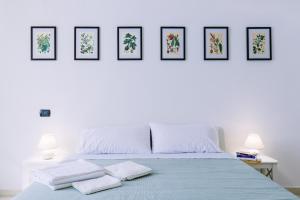 Postel nebo postele na pokoji v ubytování Pangea e Panthálassa B&B