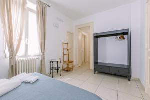 Postel nebo postele na pokoji v ubytování Pangea e Panthálassa B&B