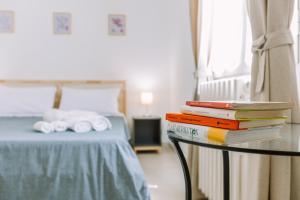 Postel nebo postele na pokoji v ubytování Pangea e Panthálassa B&B
