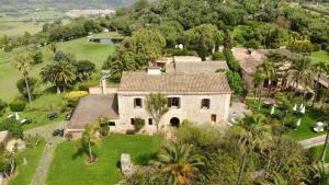 an aerial view of a house with palm trees at La Reserva Rotana in Manacor