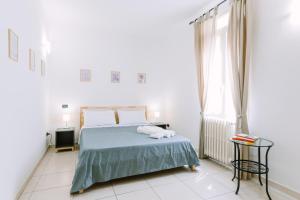 Postel nebo postele na pokoji v ubytování Pangea e Panthálassa B&B