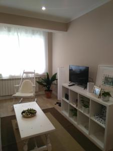 Televízia a/alebo spoločenská miestnosť v ubytovaní Torre Center II