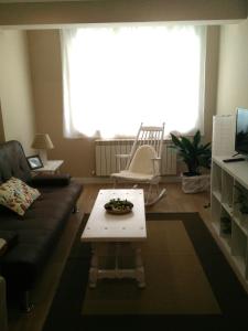Televízia a/alebo spoločenská miestnosť v ubytovaní Torre Center II
