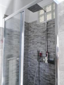 a shower with a glass door in a bathroom at LA FINESTRA SUL MARE in Ortona