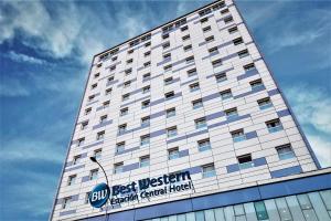 
a large white building with a blue sky at Best Western Estacion Central in Santiago
