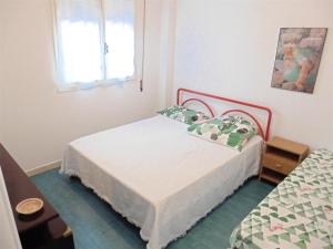 A bed or beds in a room at Appartamento Caravaggio