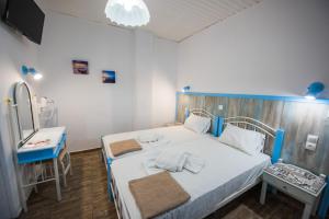 Postel nebo postele na pokoji v ubytování Anthis Studios