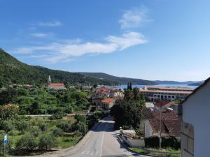 a street in a town with a view of a city at Apartments Bianki in Slano