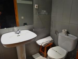 a bathroom with a sink and a toilet at Hostal Casa Laplaza in San Juan de Plan
