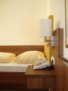Łóżko lub łóżka w pokoju w obiekcie Hotel Almtalerhof