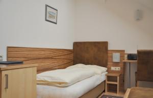 Postel nebo postele na pokoji v ubytování Hotel Almtalerhof