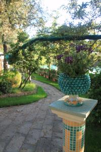 a planter on a table with a plant on it at Casa Aprea in Sorrento