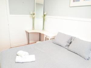 Posteľ alebo postele v izbe v ubytovaní Pension Aussie Guesthouse
