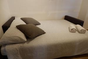 A bed or beds in a room at The Blue Strawberry House in San Giovanni Roma