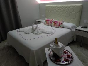 Postel nebo postele na pokoji v ubytování Hotel Primavera