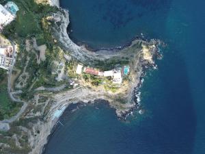 an aerial view of an island in the water at Punta Chiarito Resort in Ischia