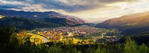 an aerial view of a town in the mountains at House Beskyd in Skole