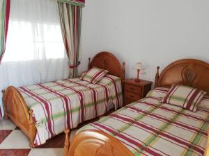 Posteľ alebo postele v izbe v ubytovaní Lulu LOCDENIA
