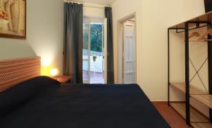 Letto o letti in una camera di Dimora Villa Serena Porto Selvaggio