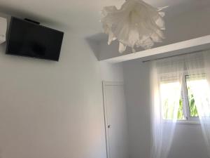 a living room with a flat screen tv on the ceiling at Bubu Beach 1-B in Los Cristianos