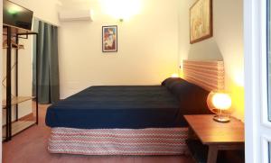 Letto o letti in una camera di Dimora Villa Serena Porto Selvaggio