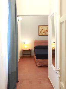 Letto o letti in una camera di Dimora Villa Serena Porto Selvaggio