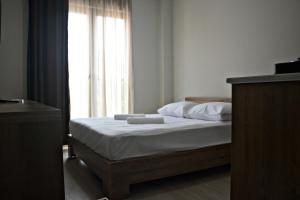 Postel nebo postele na pokoji v ubytování Apartments On Vaja Pshavela