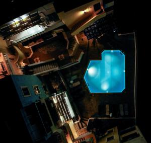 an overhead view of a swimming pool at night at Sandika apartments in Hersonissos