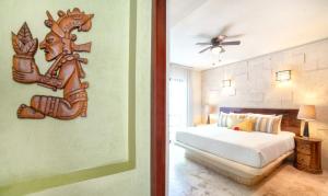 Postel nebo postele na pokoji v ubytování Maya Villa Condo Hotel and Beachclub