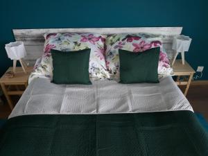 Кровать или кровати в номере Mazurskie Klimaty Tatarak