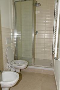 a bathroom with a toilet and a shower at Casa Martelli in Belgirate