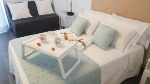 Ένα ή περισσότερα κρεβάτια σε δωμάτιο στο Apartamento Minerva Jupiter +14 φωτογραφίες