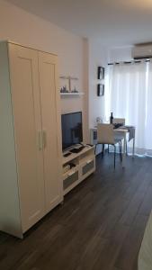 Μια τηλεόραση ή/και κέντρο ψυχαγωγίας στο Apartamento Minerva Jupiter