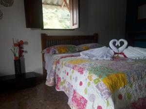 Postel nebo postele na pokoji v ubytování Hotel Dulce Campestre